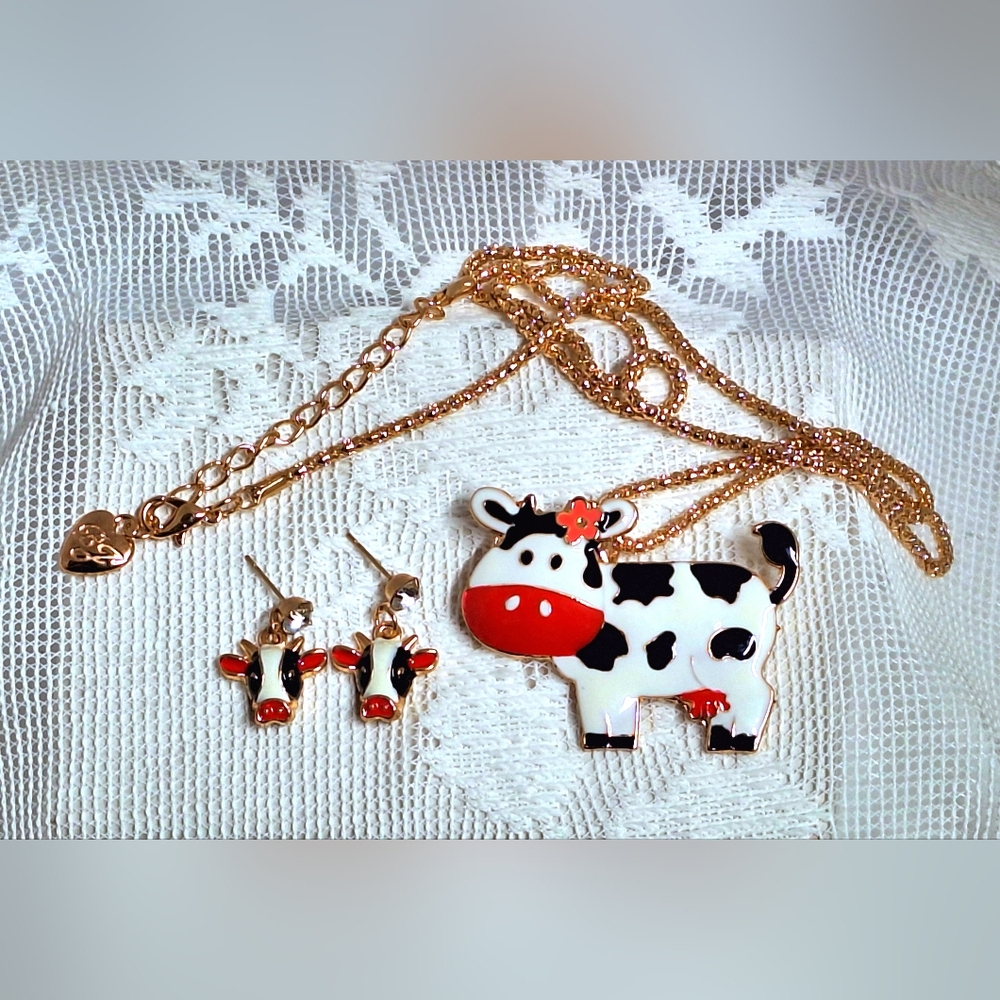 Cow pendant & earrings are gold tone with red, white & black enamel, rhinestones